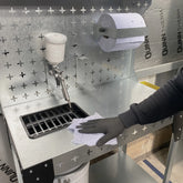 Gun wash trolley with paper towel and gun wash sink with spray gun in the holder